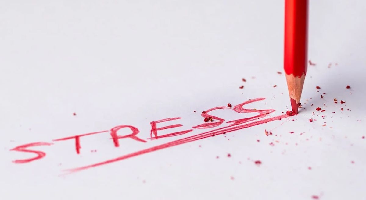 Picture of a pencil and the written word "stress"